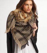 A wool and silk blend with natural fox fur trimmed collar and metal horsebit hook closure. Natural fox fur collar Handkerchief hem Fringe border About 28 from shoulder to hem 70% wool/30% silk Dry clean Made in Italy Fur origin: Finland 