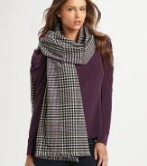 A woven plaid style with baby fringe trim. Wool About 74¾ X 25½ Dry clean Imported 
