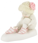 While no one is looking, this adorable baby plays dress-up. Crafted of porcelain bisque from Department 56.