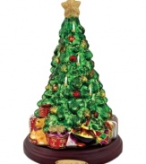 As festive as a real fir, the Lavish Tree figurine is elaborately hand painted in red, gold and glitter. Brilliant wrapped packages add to the cheerful scene from Christopher Radko.