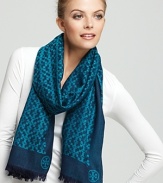 Tory Burch's iconic T is beautifully represented in this patterned oblong scarf.