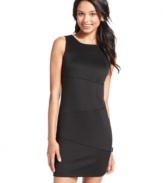 Boasting an asymmetrical seam design and slim, sheath fit, this little black dress from BCX adds sophisticated style to your dress closet.