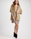 Plush faux-fur style can be perfectly paired over your favorite pleated dress or skinny jeans. Front zipper Three-quarter sleeves Fully lined About 27 from shoulder to hem 85% modacrylic/15% polyester trim 50% acrylic/20% wool/25% polyester/5% nylon Dry clean Imported