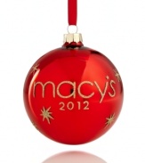 Make it memorable with the magic of Macy's and a brilliant red ball ornament adorned with dazzling gold glitter. Dated on reverse, too.