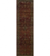 This long runner is ideal for hallways and entryways. A truly charming interpretation of a traditional carpet, this rug features a center medallion ringed by palmettes and floral details in sage green, topaz and slate blue against a rich burgundy ground. Striated effects create the weathered look of handmade rugs in a stain-resistant, no-shed manmade fiber.