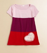 Designed in a mod colorblocked style, this charming knit A-line frock is embellished with a pretty heart apppliqué.BoatneckShort sleevesPullover styleRayon/CottonHand washImported