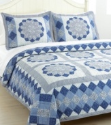 Blue blossoms in an array of fabrics create a mosaic of pure tranquility. The Blue Dahlia quilt set is hand-pieced for a traditional look and feel that makes a wonderful update for master and guest bedrooms alike. (Clearance)