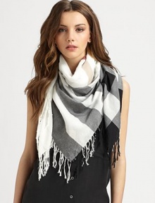 This lightweight style boasts an iconic print and all-around fringe details. CottonAbout 43¼ X 47¼Dry cleanImported 