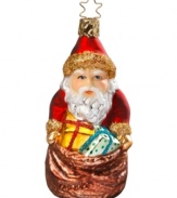 Santa Claus is coming to town! Adorn your Christmas tree with this festive Inge-Glas ornament featuring Santa and his bag of goodies. Mouth-blown and hand-painted.