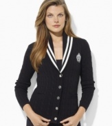 Inspired by Ivy League style, Lauren by Ralph Lauren's classic cabled cardigan is crafted with a shawl collar and signature embroidery.