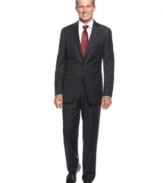 Searching for a look that's at once classic and cutting-edge? Look no further than this sleek charcoal striped suit from Tasso Elba.