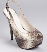 In glossy, snake embossed leather, Stuart Weitzman's Vevey platforms boast a petite peep toe and adjustable slingback.