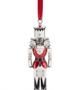 A classic symbol of Christmas re-purposed for your tree, the Lenox nutcracker ornament glistens in polished silver plate with sparkling rhinestone and holiday-red accents.