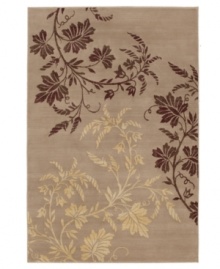 An intricate and striking floral motif cascades across a soothing ground in this Karastan area rug, offering a soothing nature-inspired accent for any room. Thick and resilient underfoot, this plush piece is woven from 2-ply nylon pile, ensuring easy care and long-lasting wear.