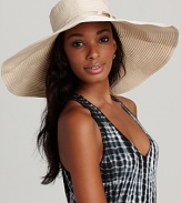 A large ribbon floppy hat with exposed stitching and ribbon tie, a perfect piece for a glamorous girl.