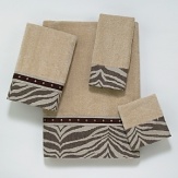 Luxurious velour towel is embellished with a contemporary border featuring a zebra chenille fabric in neutral tones. The border is finished with a suede-like nailhead trim.