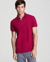 Burberry's check print lines the placket of this sharp slim-fit polo.