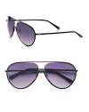 The classic aviator is reinvented in this modern update with logo detail on the lens and tip of temples. Available in black frames with grey gradient lenses.Metal100% UV ProtectiveMade in Italy