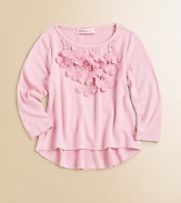 Rows of floral appliqués lend a girly touch to a long-sleeved, everyday knit.Round necklineLong sleevesPullover styleHi-lo hemViscose/SpandexHand washImported