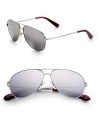 Reflect on style in these metal frames. Available in khaki gold with gray bronze mirror lens or bluette palladium with silver mirror lens. Logo temples 100% UV protection Imported 