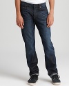Slim fit jeans in a distressed dark wash for denim with a rugged attitude by J Brand.