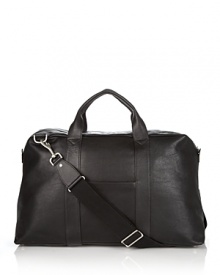 Soft grained leather duffel bag with zipper and top handles. Two slip pockets on each side. Interior pockets for organizing. Optional strap for carryon. Soft grained leather duffel bag with zipper and top handles. Two slip pockets on each side. Interior pockets for organizing. Optional strap for carryon.