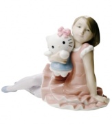 The picture of happiness, this handcrafted figurine depicts Hello Kitty and a young friend in premium Lladro porcelain with a pretty, muted palette.