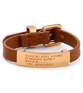 Inspired by surplus style, this MARC BY MARC JACOBS bracelet flaunts a commanding mix of leather and brass. Slip it on to flash your fashion credentials.