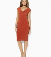 A dashing cowl neckline and a slinky ruched waist form the flattering, feminine silhouette of this dress, rendered in exquisitely smooth stretch matte jersey.