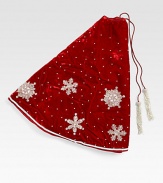 EXCLUSIVELY AT SAKS. Shimmering hand-embroidered snowflakes float across this lush velvet tree skirt, from renowned designer Sudha Pennathur. HandcraftedVelvet with bead embroidery50 diam.Dry cleanImported