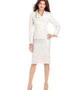 Le Suit puts a contemporary spin on the traditional skirt suit, adding asymmetrical details to the jacket and a chic bow embellishment at the collar.