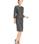 Kasper's suit makes a contemporary statement with a collarless jacket and streamlined skirt outfitted in a striking variegated pattern.
