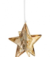 Star bright. The Golden Shadow Star ornament brings new brilliance to modern holidays, combining the gleam of Swarovski crystal with goldtone metal and sparkling chatons.