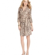 The skirt suit, updated. Nine West's modern take features a chic animal print, belted jacket and pretty pleating at the skirt.