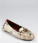 A classic driver shoe gets an exotic update in python printed leather. From Tory Burch.