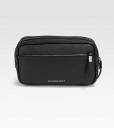 This textured leather design is perfect for all your travels.Zip closureOne outside zip pocketFully lined10½W X 5½H X 4¼DMade in Italy