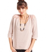 Eyeshadow joins sheer lace insets with easygoing, sweatshirt style on a top that belongs in our closet, stat!