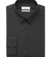 Handsome pinstripes and a flattering fit make this Calvin Klein dress shirt an instant classic.
