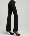 Tuck a print blouse into these high waist jeans for a chic, femme look for the new season. Elongate your silhouette with high wooden platforms and evoke a luxe '70s vibe.