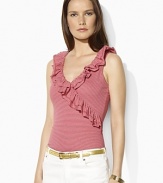 A flourish of ruffles along the neckline lends feminine appeal to a faux-wrap sleeveless top in soft cotton jersey.