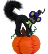 Scared silly, a black cat arches her back and poofs her tail atop the orange pumpkin in this whimsical Annalee figurine. A soon-to-be Halloween favorite.