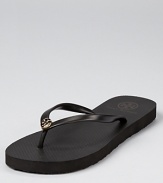 A petite logo gleams at the front of these versatile flip flops, the perfect tool for chic summer style. From Tory Burch.