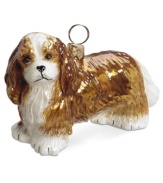 Puppy love at first sight. Just begging for a home, this Cavalier King Charles Spaniel ornament is irresistible to animal lovers in hand-painted glass by Joy to the World.