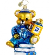Celebrate two holidays at once with a Christopher Radko ornament made for Hanukkah. A suited-up teddy bear spins a dreidel in mouth-blown, hand-painted glass.