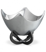Set or simply decorate the table with the ultra-modern Anvil Scroll bowl from Nambe. A sculptural, iron-finished base cradles contoured silvertone alloy in this innovative Neil Cohen design.