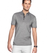 A button-down collar adds some extra polish to this pique polo shirt from Calvin Klein.