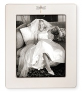 Part of the beloved collection from kate spade, this frame features a graceful dragonfly motif on fine ivory bone china. The perfect way to add a touch of fanciful whimsy to your favorite photo.