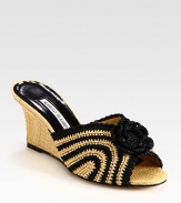 Intricately woven straw wedge with contrasting trim and a darling flower adornment. Straw wedge, 3 (75mm)Straw upperLeather lining and solePadded insoleMade in ItalyOUR FIT MODEL RECOMMENDS ordering one half size up as this style runs small. 
