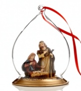 Covered by a clear, opulent glass dome, Mary and Joseph adore their newborn son in this ornament to be treasured for years to come.