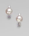 A classic design with a hint of sparkle for a truly versatile piece. 12mm round white organic man-made pearlsCubic zirconiaSterling silverSize, about ¼Post backImported 